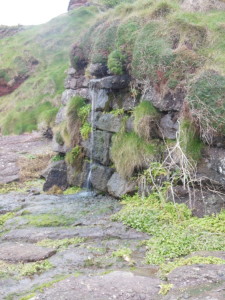 There was water streaming from here, down the rocks to the ocean.